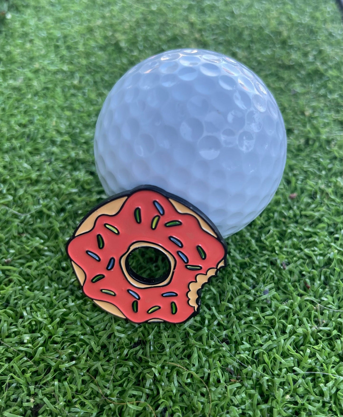 Premium golf ball markers with unique and stylish designs, crafted for durability and enhancing your golf game.