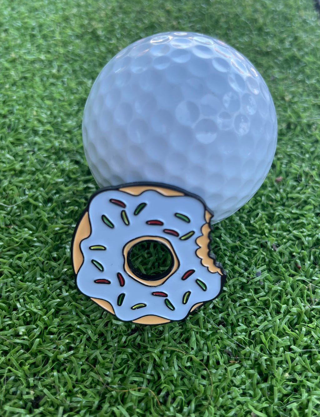 Sandybirds Golf Gear Blue Donut Ball Marker - Premium quality golf ball marker made of zinc alloy, featuring a vibrant blue donut design. A stylish and unique accessory for golf enthusiasts seeking to enhance their game with a touch of flair.