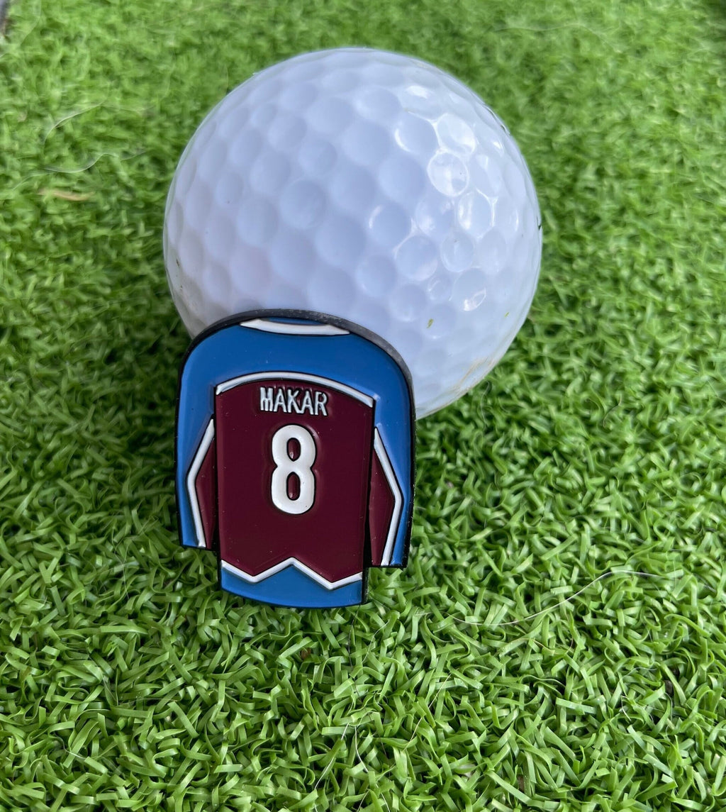 Sandybirds Golf Gear Makar Ball Marker - Premium quality golf ball marker made of zinc alloy, designed in the shape of a Makar jersey. A perfect accessory for golf enthusiasts looking to add a touch of style and precision to their game.